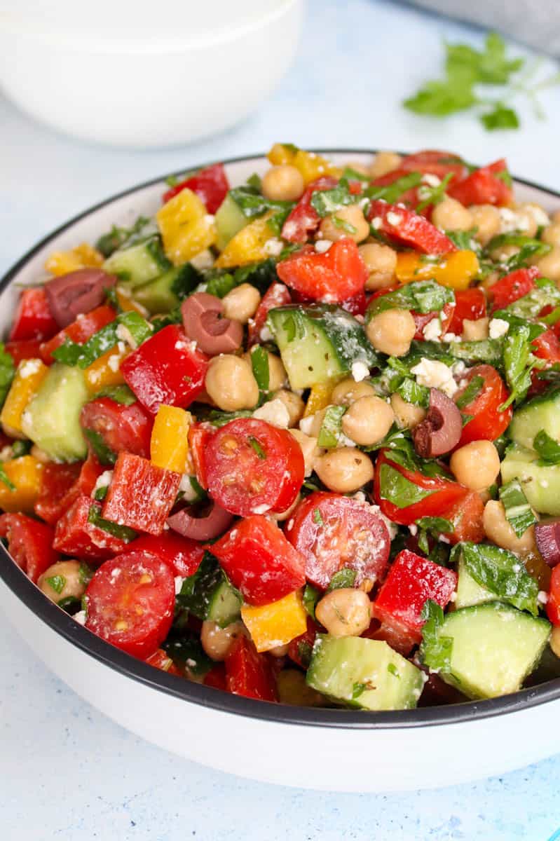 Mediterranean chickpea salad, chopped tomatoes, cucumbers and bell-peppers 