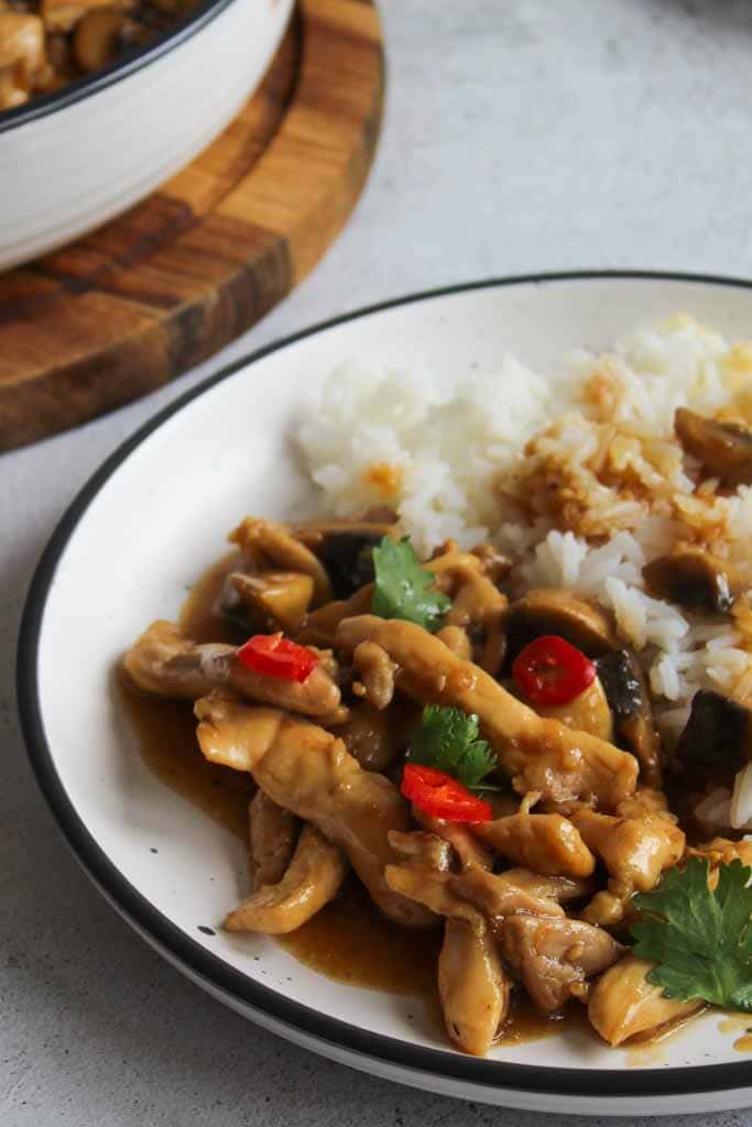 Chinese lemon chicken with mushrooms served with rice