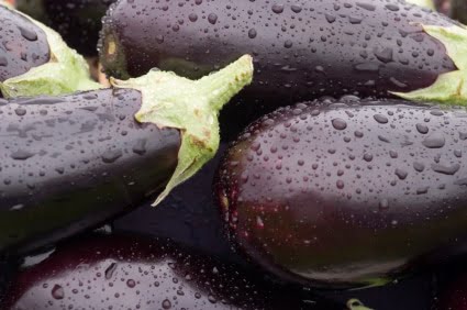 purple eggplants with water droplets  
