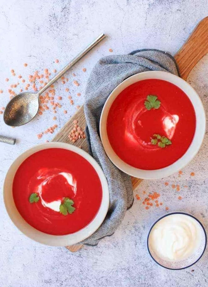 Two bowls with beetroot soup