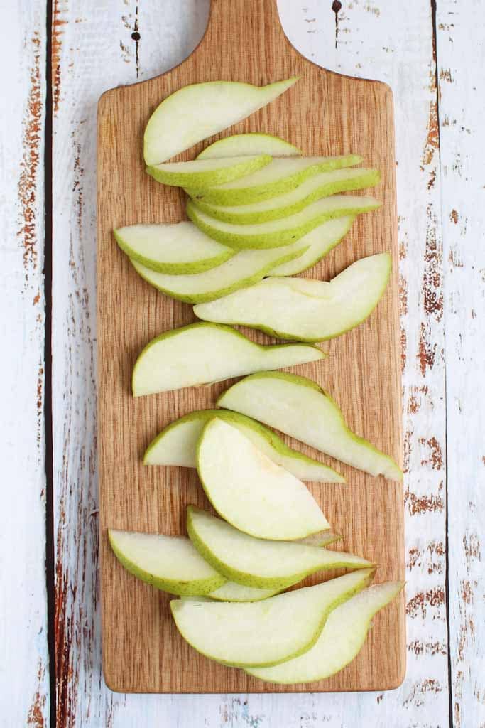 pear slices on a wooden chopping board