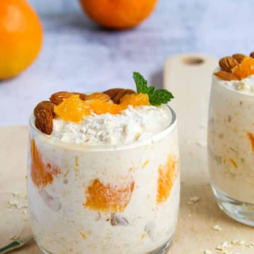 orange and coconut overnight oats in a glass