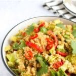 Quinoa salad with tahini dressing in a white plate, pinterest image