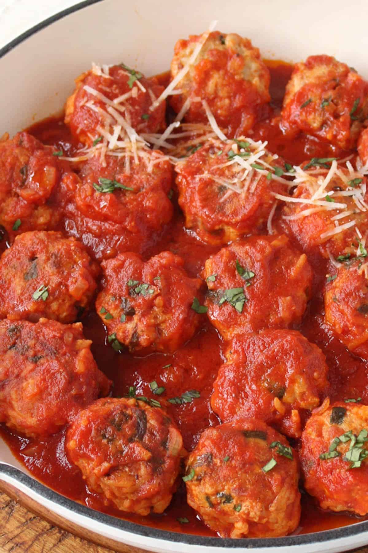 close up photo of meatballs in tomato sauce
