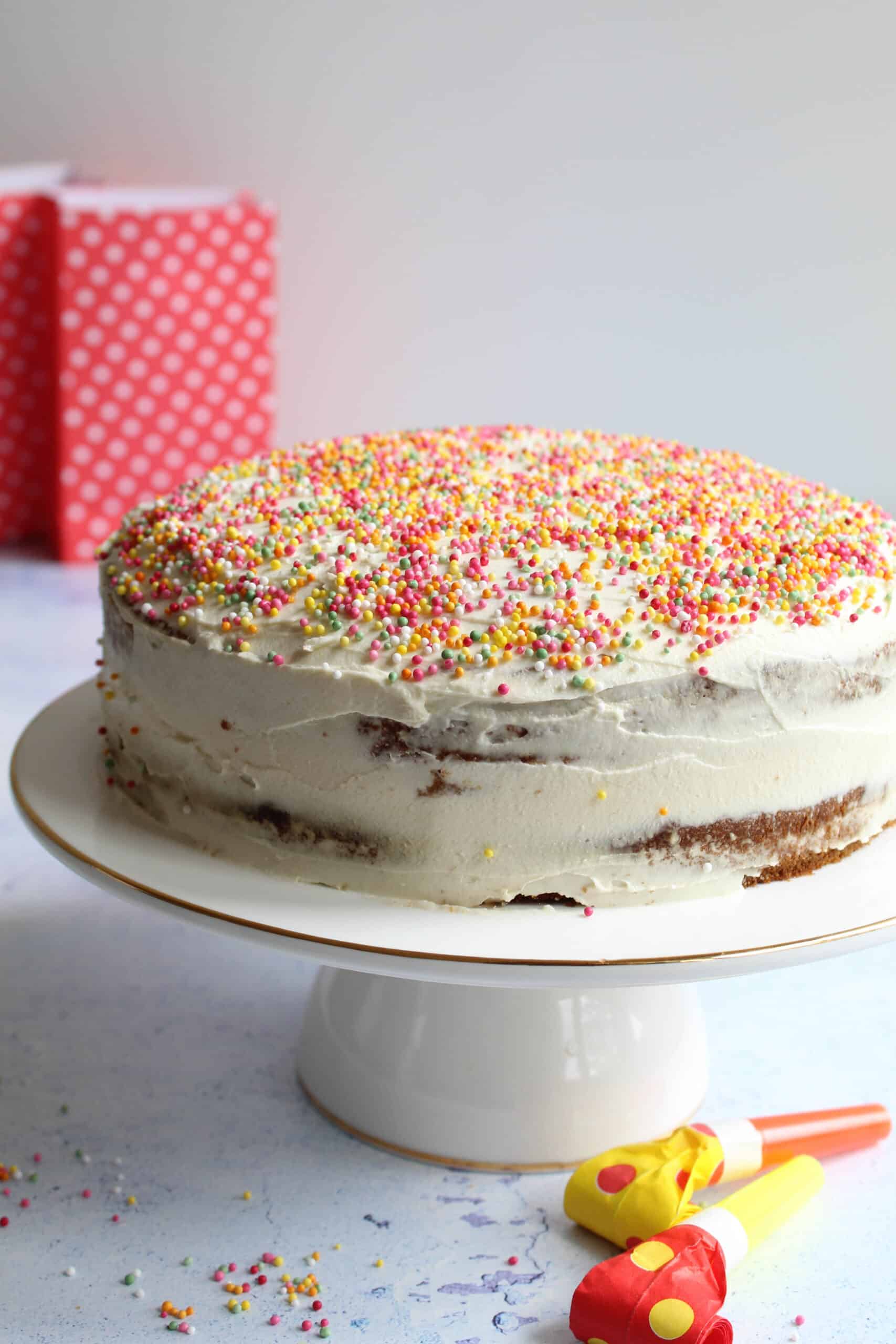 gluten-free birthday cake on a cake stand