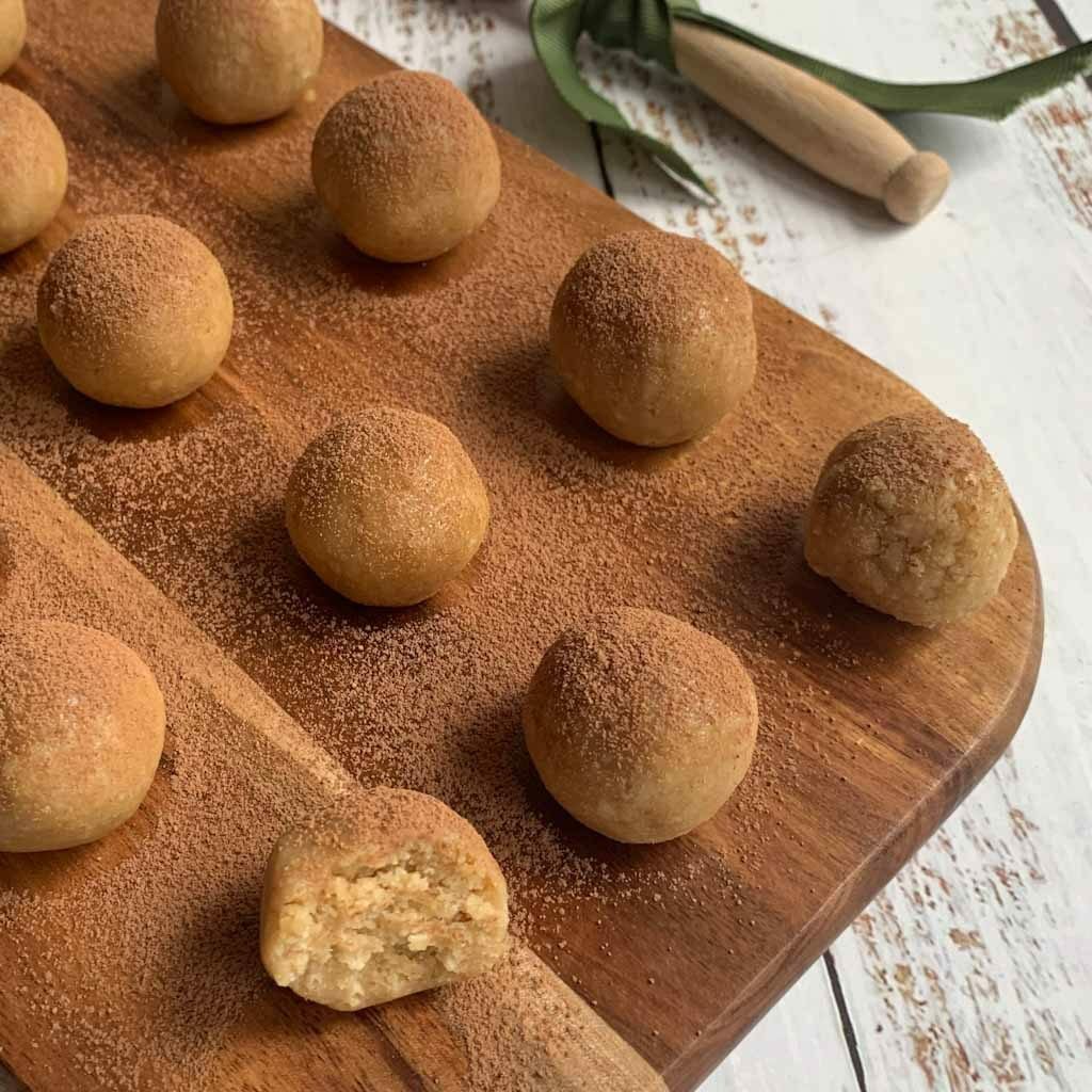 small cookie dough balls on a wooden board