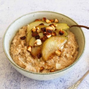 oats in a bowl with caramelized pears and nuts