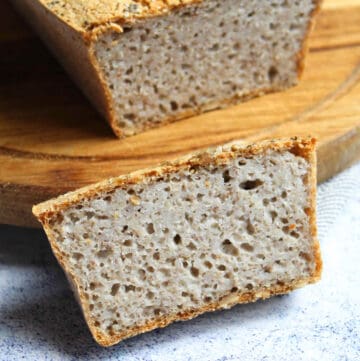 a slice of buckwheat bread on a wooden chopping board