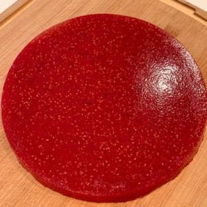 large round jelly on a wooden board