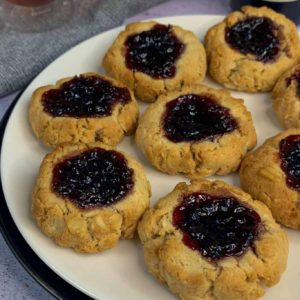 gluten-free jam-drop cookies on a white plate