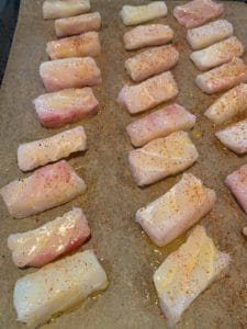 seasoned fish bites on a baking tray