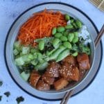poke bowl in a round bowl with chopsticks