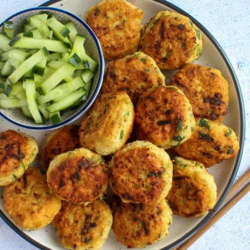 Thai fish cakes on a plate served with cucumber relish