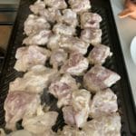 butter chicken marinated raw chicken cooking on scanpan griddle