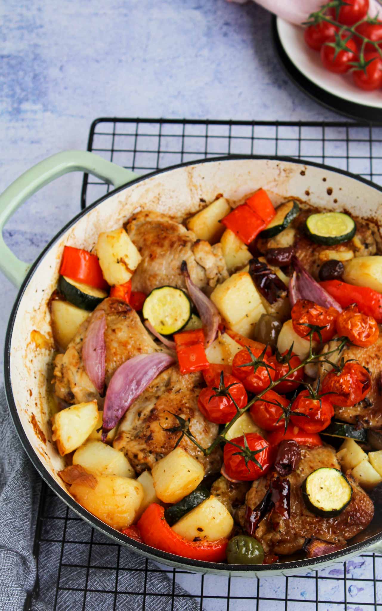 Greek style roast chicken in one pan with zucchini, capsicum, purple onions and cherry tomatoes and fetta.