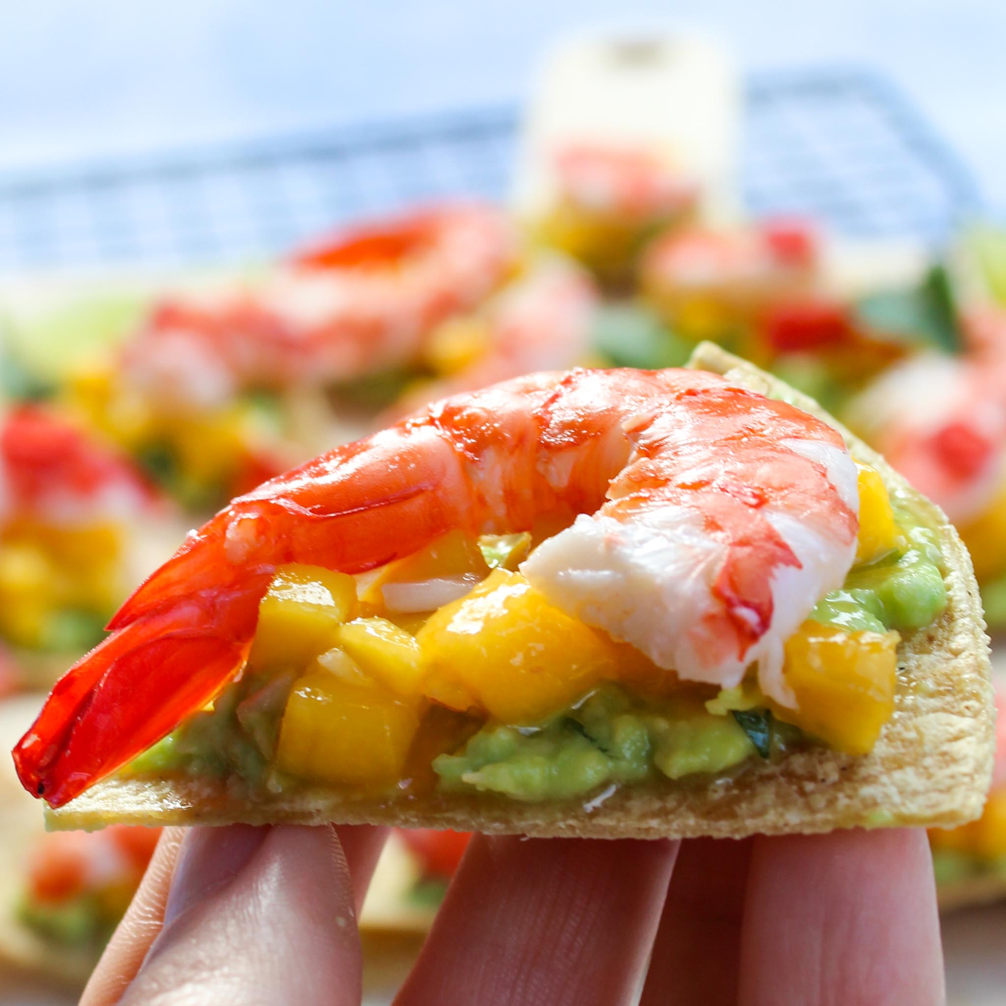 close up photo of prawn on mango salsa and corn chip for Shrimp Appetizer Recipe