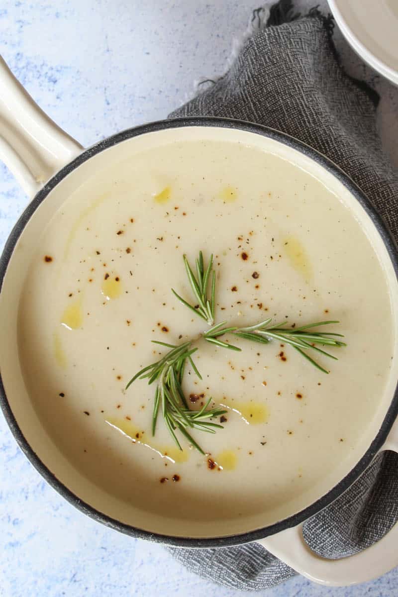 a pot with creamy vegan cauliflower soup