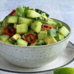 cucumber and avocado salad in a grey salad bowl