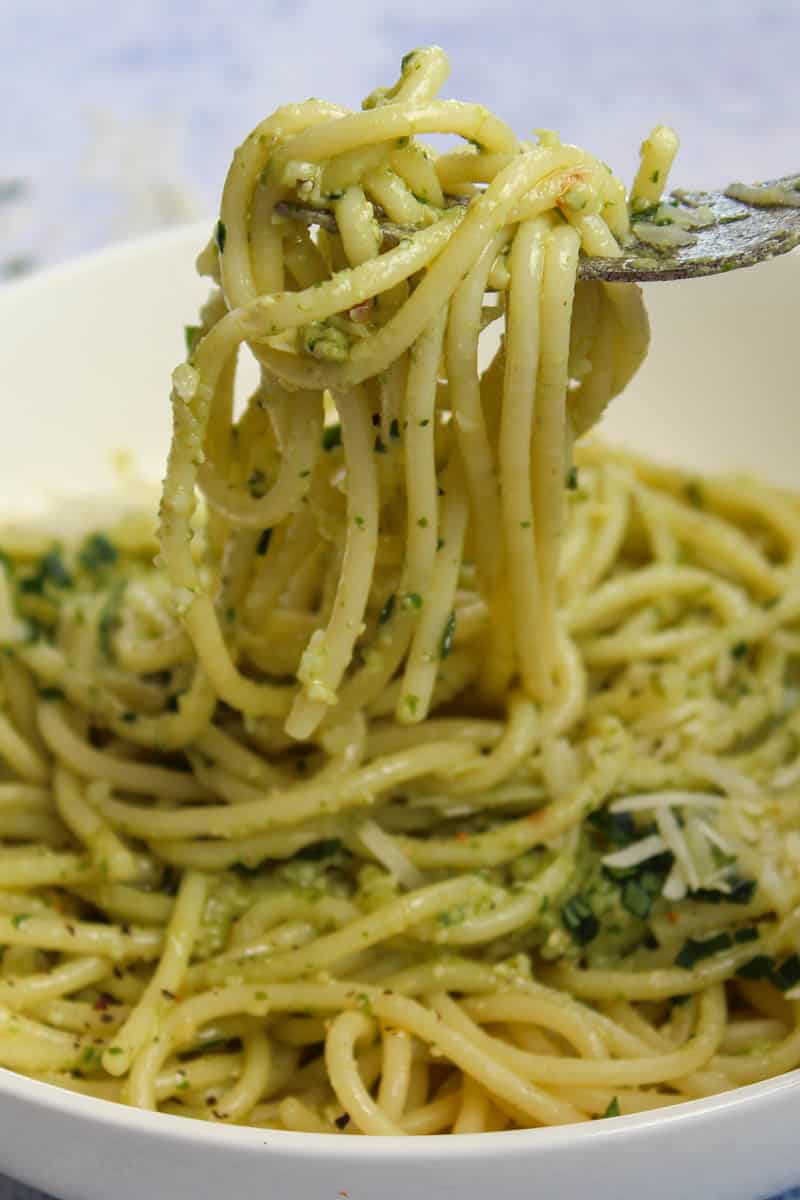 pesto spaghetti on a fork ready to eat