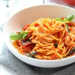 Spaghetti arrabbiata in a white bowl