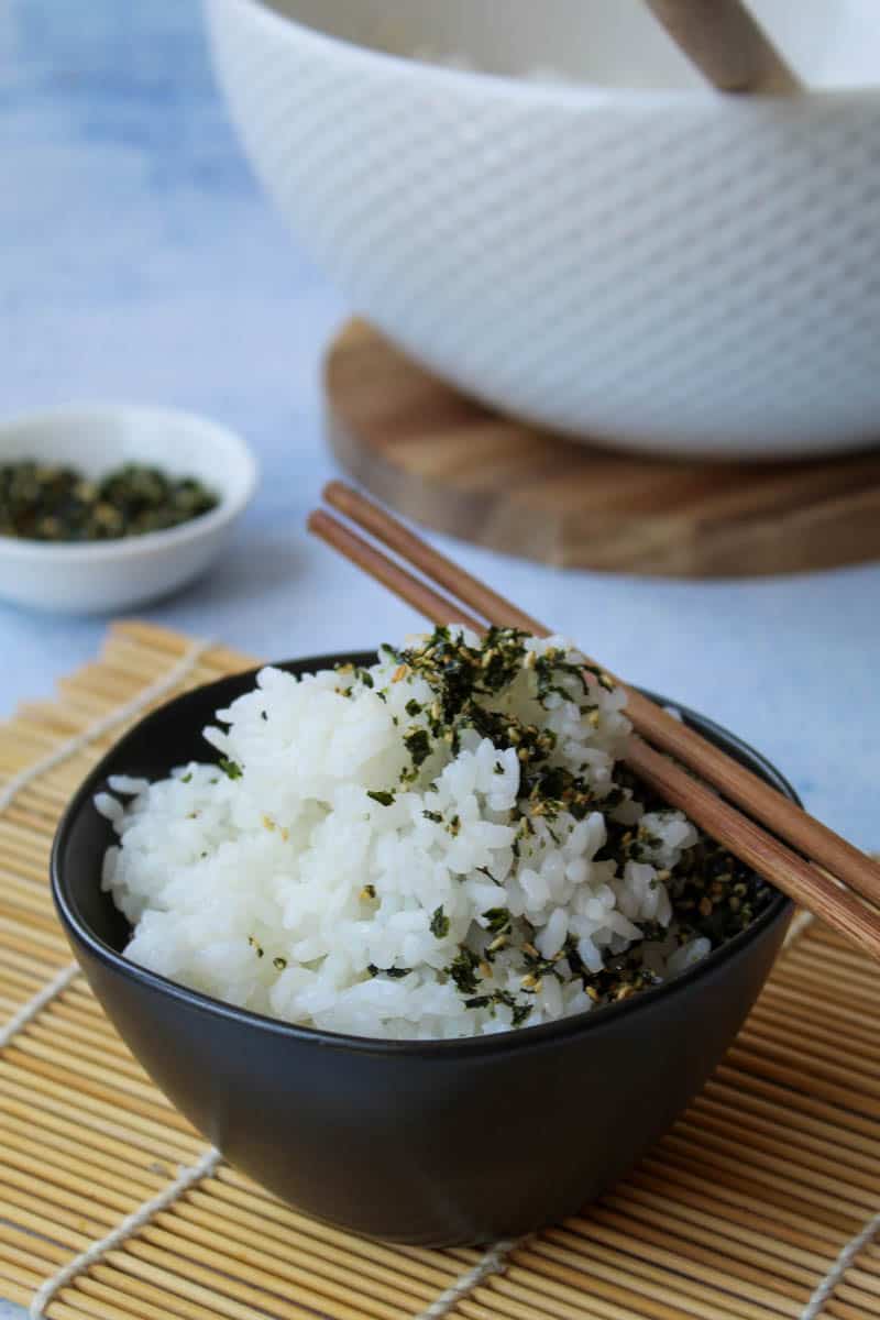 a small bowl with cooked rice