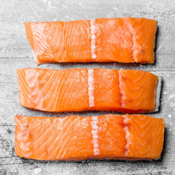 three fresh salmon fillets