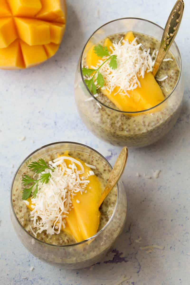 two glass cups with mango chia puding