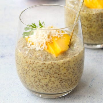 a glass cup with mango chia pudding