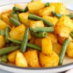 close up shot at beans and potatoes on a plate
