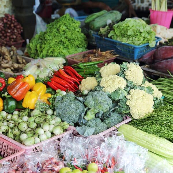 a market stall with fresh vegetables