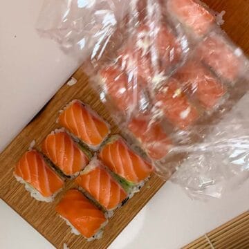 peeling off glad wrap from sushi nigiri
