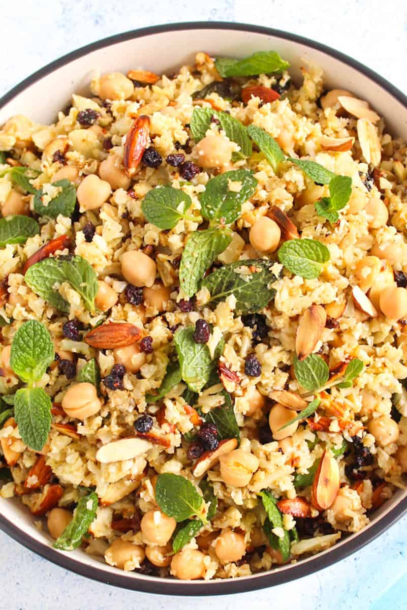 roasted cauliflower rice saladserved with almonds, mint and chickpeas