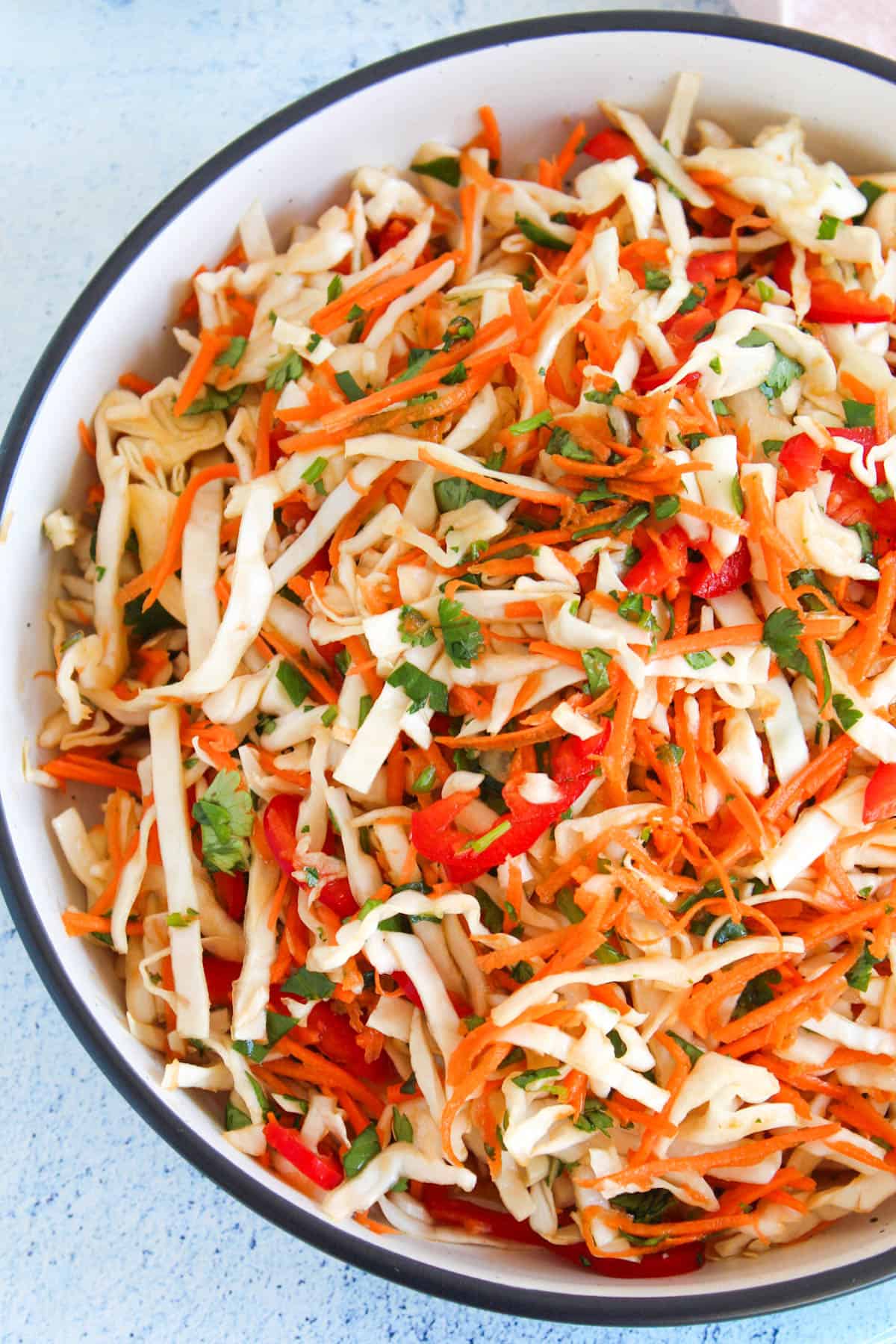 a large bowl with Asian slaw