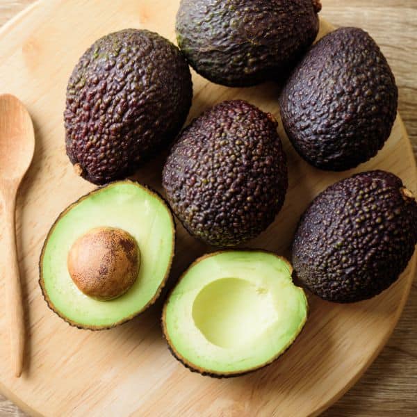 ripe avocados on a wooden board