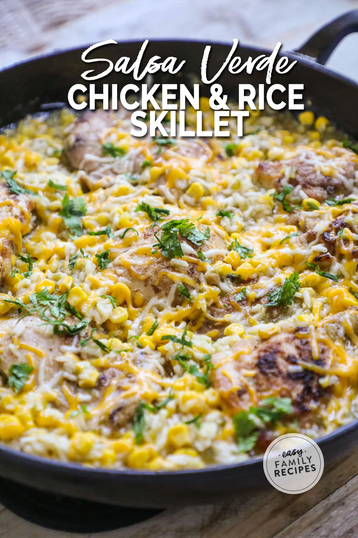 chicken baked with corn, rice and cheese in a skillet