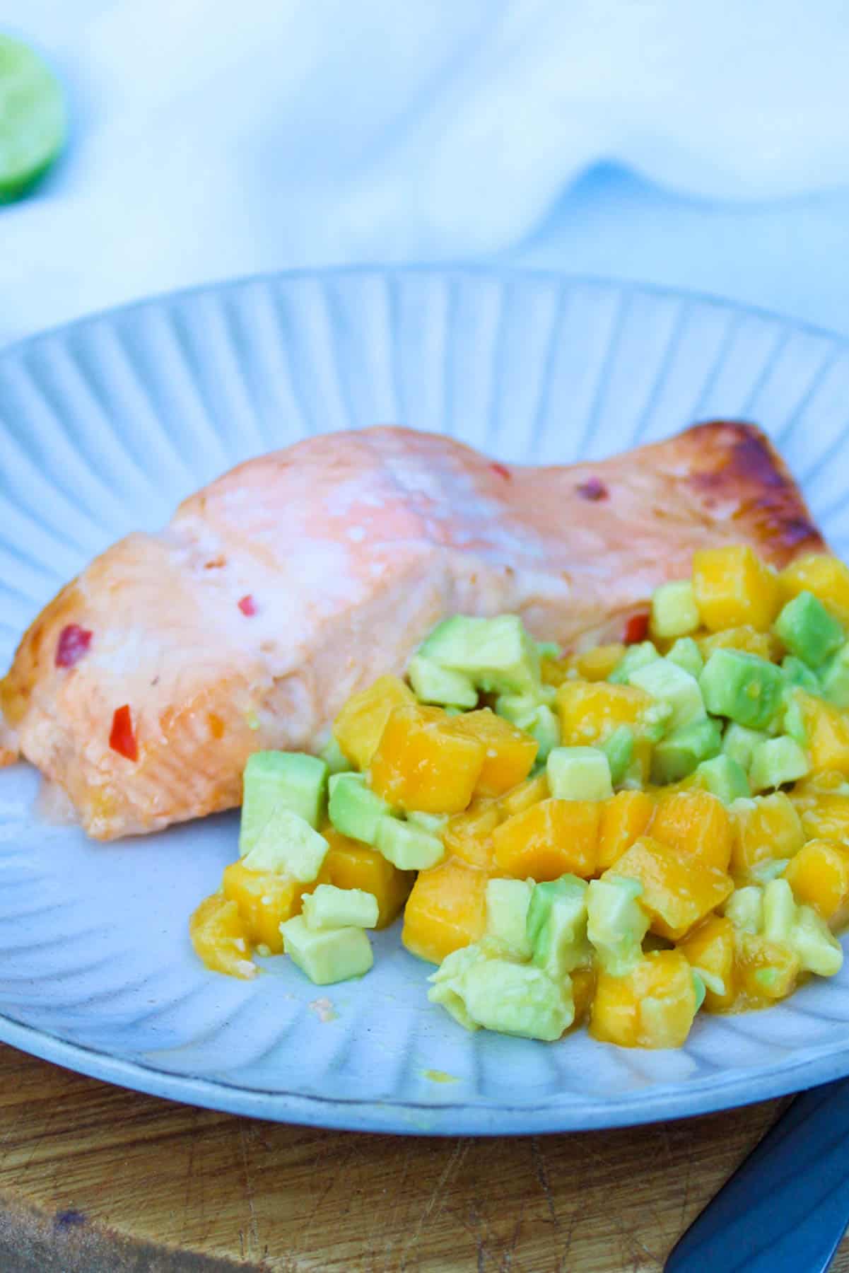 baked salmon served with mango and avocado salsa