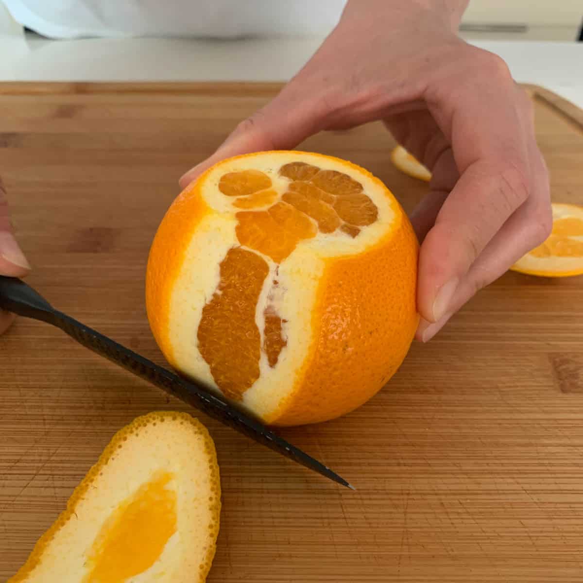 process of cutting skin of an orange