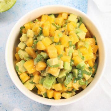 a bowl with avocado mango salsa