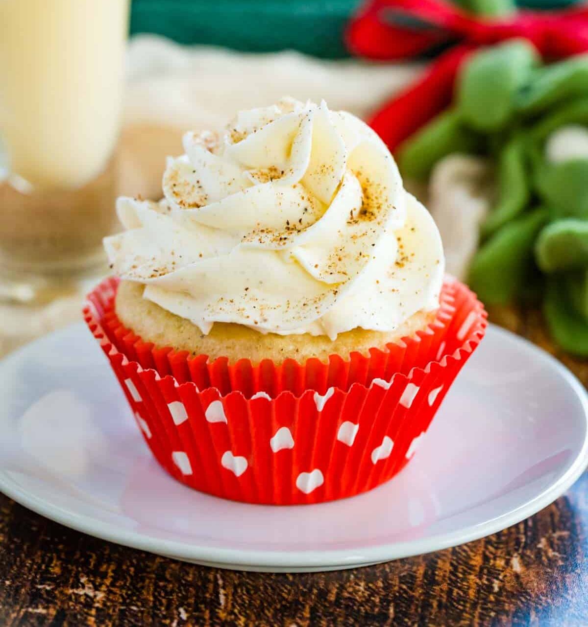 a cupcake with eggnog, picture looks very Christmasy