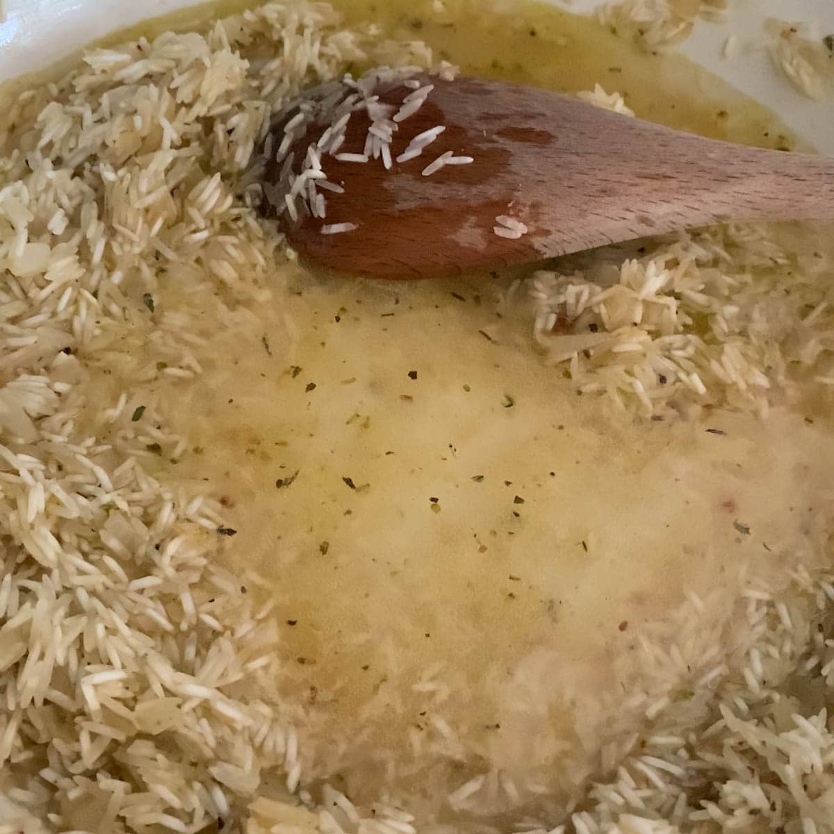 raw rice in a frying pan