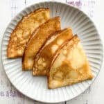 4 gluten-free crepes on a grey plate.