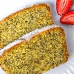 Two slices of freshly baked lemon pound cake on a plate.