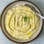 Mashed cauliflower in a white plate ready to be served.